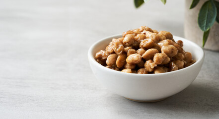 natto or fermented soybean in bowl on table white background. natto or fermented soybean Japanese food. natto ferment soybean white background