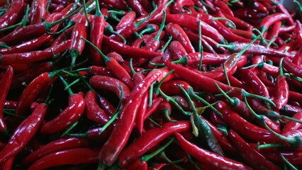 Top view pile of red hot chili peppers, natural background