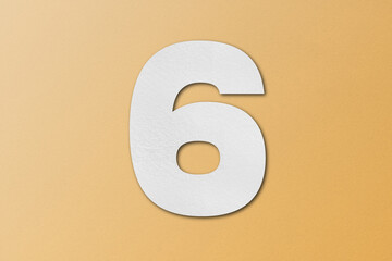 White paper font number 6 isolated on orange background.
