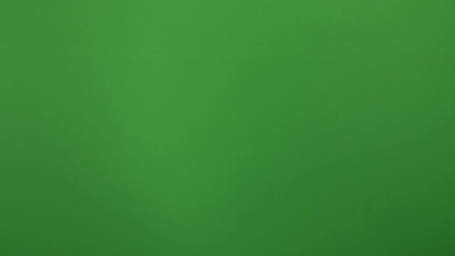 Closeup shot of handing over Indian currency notes to a female - green background  Rs 500 notes  cash handover  business deal  offering money. Financial business concept on a green screen - finance...