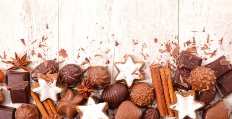 assorted of chocolate candies, gingerbread cookies and spices