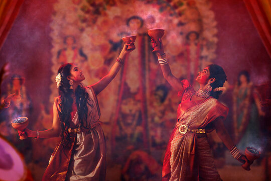 Bengali women performing dhunuchi dance on the occasion of Durga Puja