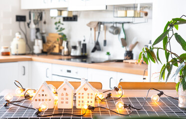 Key to house of cozy home on table of kitchen. Building, design, project, moving to new house, mortgage, insurance, rent and purchase real estate