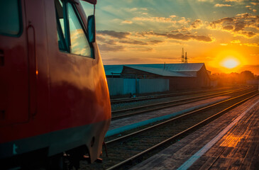 The train goes into the sunset. Forward movement