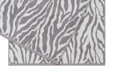 cotton terry towels with an animalistic pattern, stacked, isolated