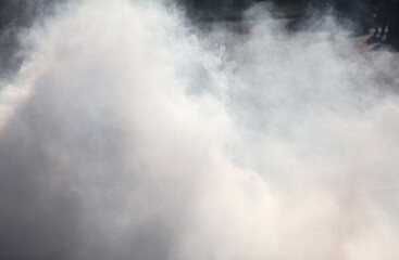 Smoke from under the wheels of the car. Background