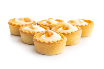 Sweet tarlets. Tasty mini tarts. Mini pie with cream isolated on white background.