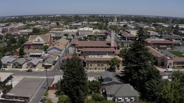 Lodi, California, USA - July 16, 2021: Sunlight shines on the historic downtown buildings and churches of Lodi.