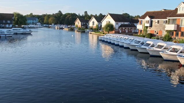 The River Bure in the village of Wroxham in the heart of the Norfolk Broads. Captured early morning as the sun was rising