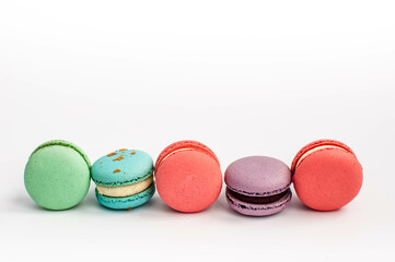 multi-colored macaroons on a white background