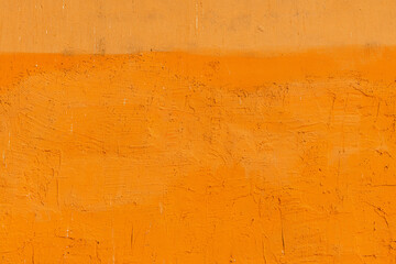 Rough yellow plaster wall as grunge texture