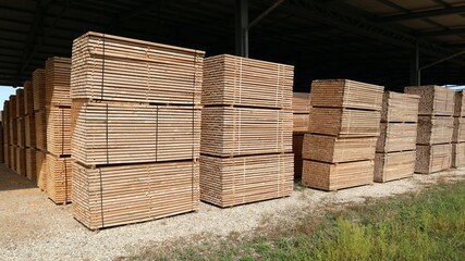 Storage of manufactured laminated wood outside a lumber factory.