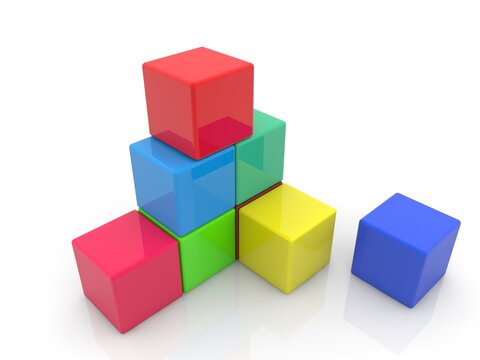 An abstract, unfinished pyramid of colorful toy cubes