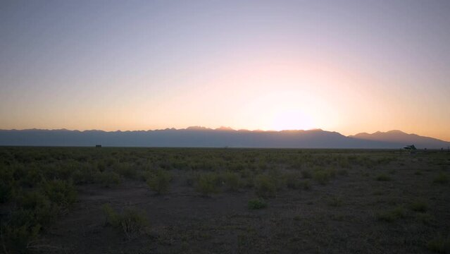 Sunrise peeking over the La Sal Mountains in Crestone Colorado, static time lapse