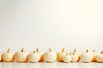 Obraz na płótnie Canvas White pumpkins on white backdrop with copy space top. Pumpkin minimal background. 