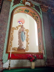 Sculptures of the Virgin Mary, holy apostles and angels in the cathedral hall.