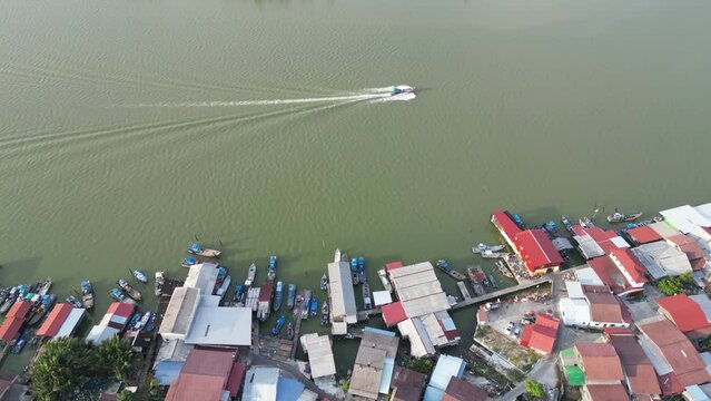 Aerial follow fishing boat back home at Sungai Udang, Penang
