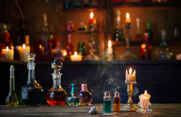 magic potions in bottles on wooden table - Powered by Adobe