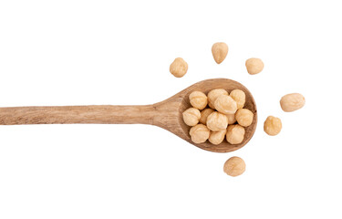 heap of hazelnuts in spoon isolated on white background with clipping path, top view, concept of healthy breakfast, vegan food