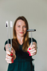 Neurological tuning fork in the hands of a neurologist.