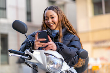 young girl using her smartphone to rent a scooter