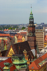 Town hall and multicolored bright houses on the Market square at Old Town in Wroclaw, Poland. Top view from the Bridge of Penitents of Cathedral of St. Mary Magdalene  © Blumesser