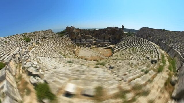 Aerial HYPER-LAPSE ancient Roman Theatre in Perge, Turkey, stands as an impressive testament to the architectural achievements of antiquity. Dating back to the 2nd century AD.