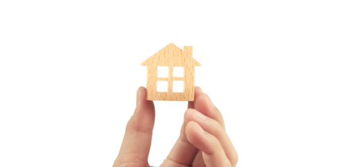 holding house representing home ownership and the Real Estate business