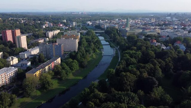 Ostrava Ostravice River drone video, City Hall Tower and Comenius Park (Komenského sady), historical border of Silesia and Moravia, Czech Republic
