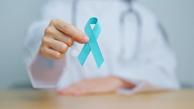 Blue November Prostate Cancer Awareness month, Doctor with Blue Ribbon in hospital for support people life and illness. Healthcare, International men, Father, Diabetes and World cancer day