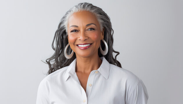 Elegant mature black woman with a joyful smile, smooth complexion, and long gray hair, ideal for beauty and cosmetics advertising, isolated on white,banner
