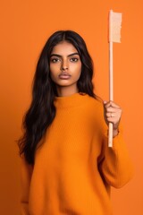 A Fictional Character Created By Generative AI.Beautiful Woman in Orange Outfit