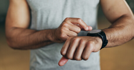 Smart watch, hands and man in gym for fitness, exercise results and workout performance. Stopwatch, closeup and check information, timer and tracking healthy training progress, clock and sports gear