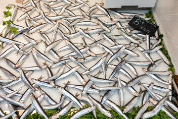 Fresh, glistening boquerones catch your eye at the bustling fish market.