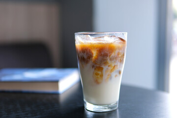 Ice latte with lactose-free milk oat or banana almond coconut milk in a delicious sweet drink close-up macro photography stir add ice. several videos