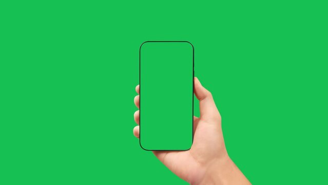 Hands holding smartphone with green screen in green background vertical green 