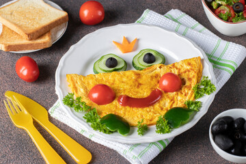 Breakfast idea for kids - frog princees shaped of omelette with vegetables, Close up
