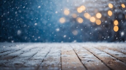 Naklejka na ściany i meble Beautiful winter snowy blurred defocused blue background and empty wooden flooring. Flakes of snow fall and sparkle on light, copy space.