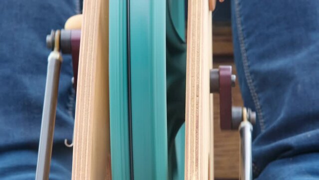 The retro design of the spinning wheel adds a vintage touch to the craft room