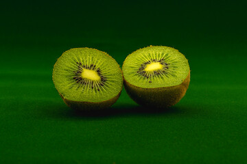 kiwi fruit on a green table