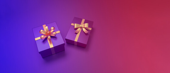 Gifts box with golden ribbon on gradient background.