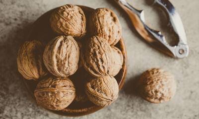 Walnut and nutcracker on vintage background
