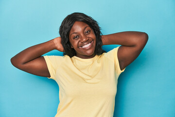 Young african american curvy woman stretching arms, relaxed position.