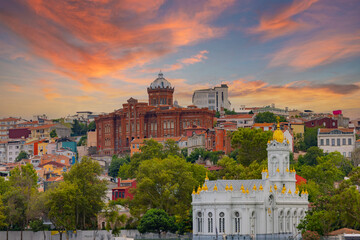 View from Golden Horn of Neo Byzantine architecture style Bulgarian St. Stephen Church, a Bulgarian Orthodox church, with Phanar Greek Orthodox College in the far end, Balat district, Istanbul, Turkey - obrazy, fototapety, plakaty