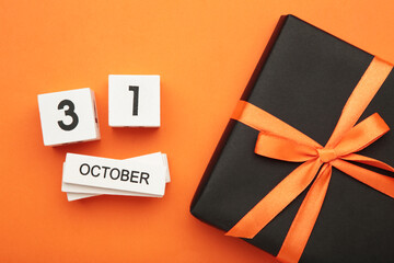 Happy Halloween day with pumpkin and 31 October calendar on orange background. Trick or Threat,...