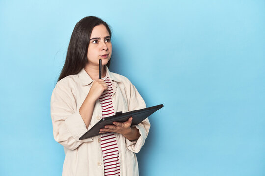 Creative designer woman with a graphic tablet in the studio - Powered by Adobe
