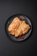 Delicious fried chicken chop or pork meat fried breaded with salt, spices and herbs