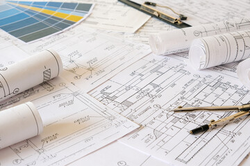 architect design working drawing sketch plans blueprints and making architectural construction model in architect studio,flat lay.