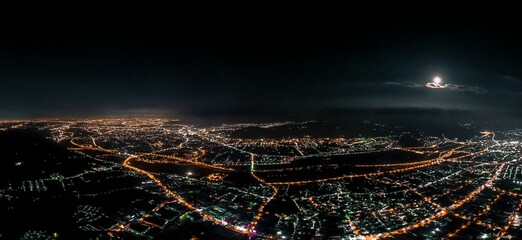 Aerial view of a vibrant and bustling Taiwan City at night.