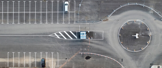 Abstract aerial view from a drone of circle junction road and car parking